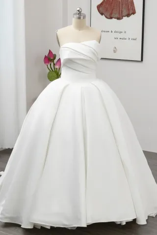 pearled asymmetrical neck ivory matte satin bridal gown