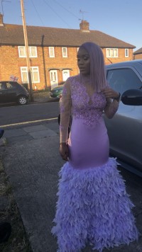 light purple prom gown with feather skirt