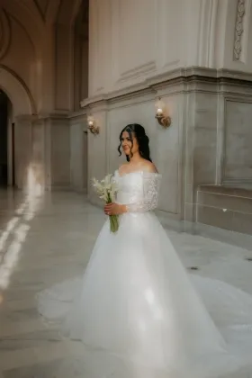 overskirt to achieve an A line style wedding dress